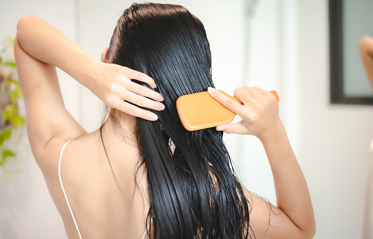 a woman doing hair care 