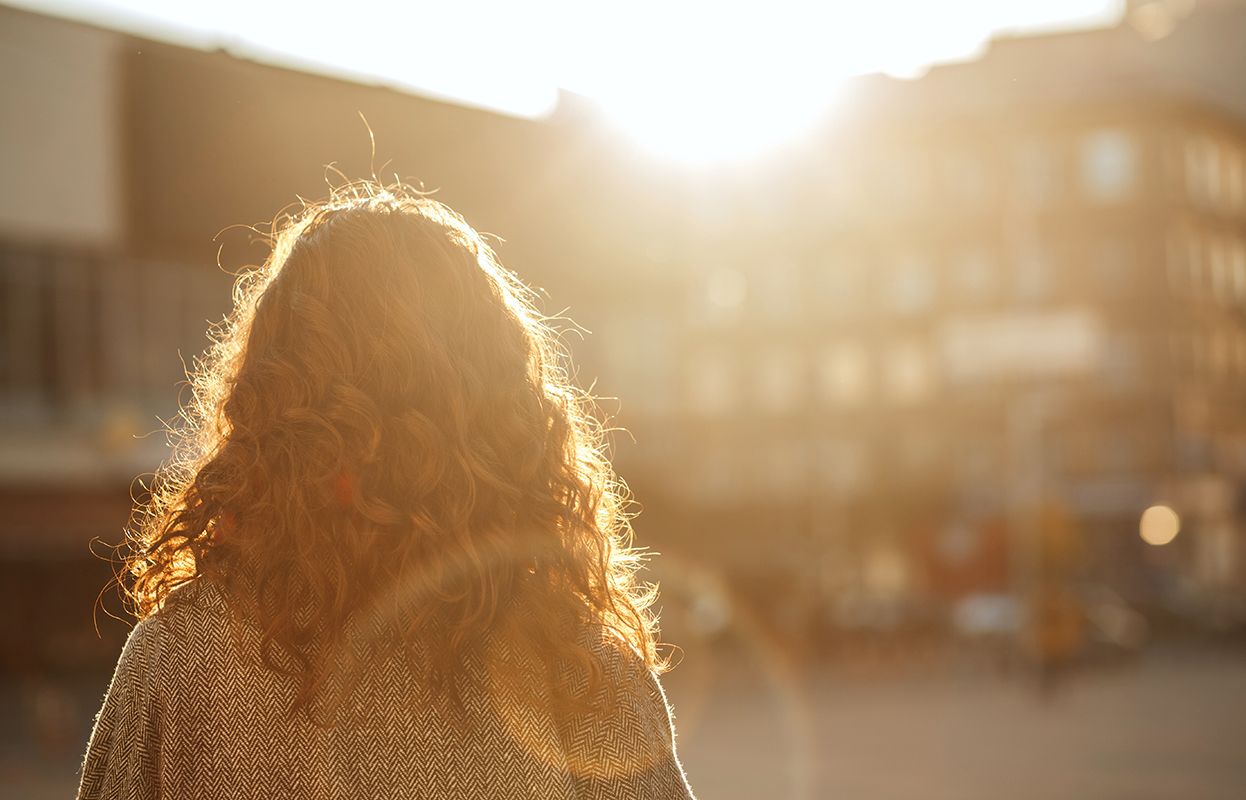 A Man or Woman with Sun rays on hair