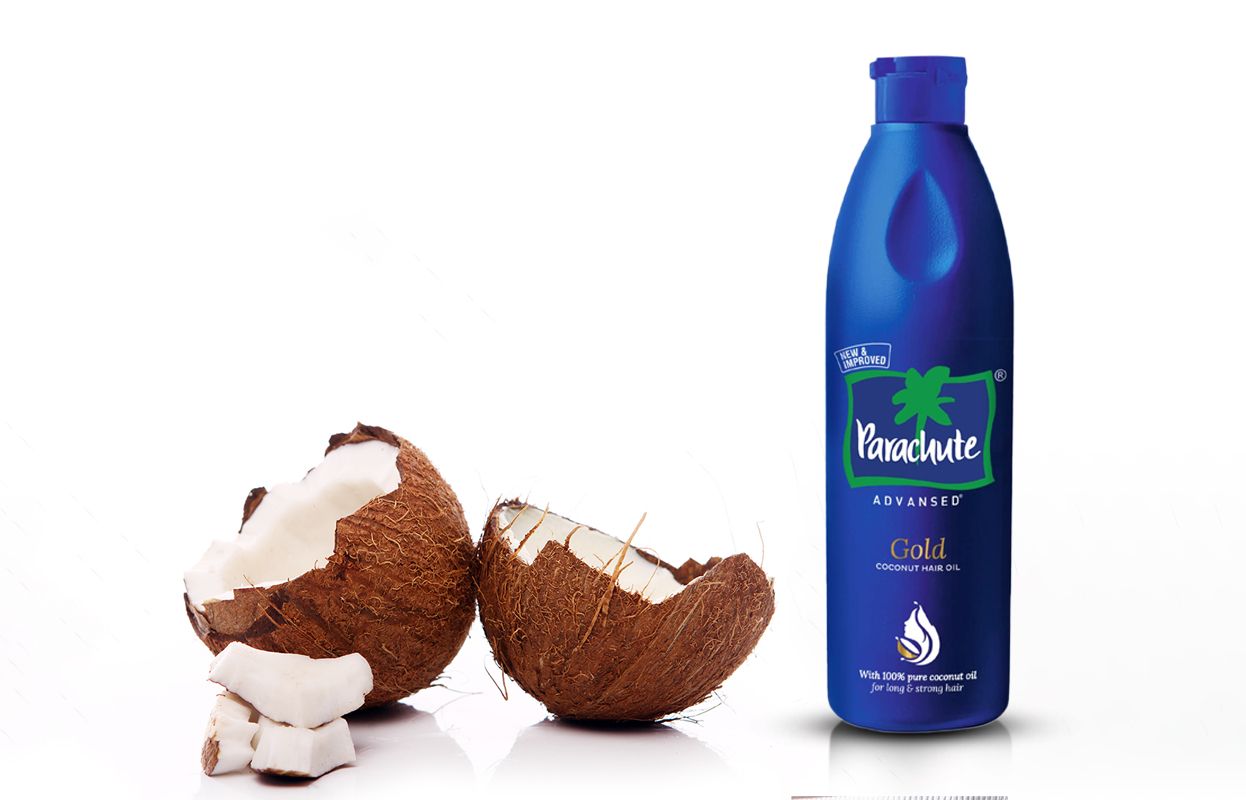 Parachute Advansed Gold Coconut Hair Oil with broken coconuts