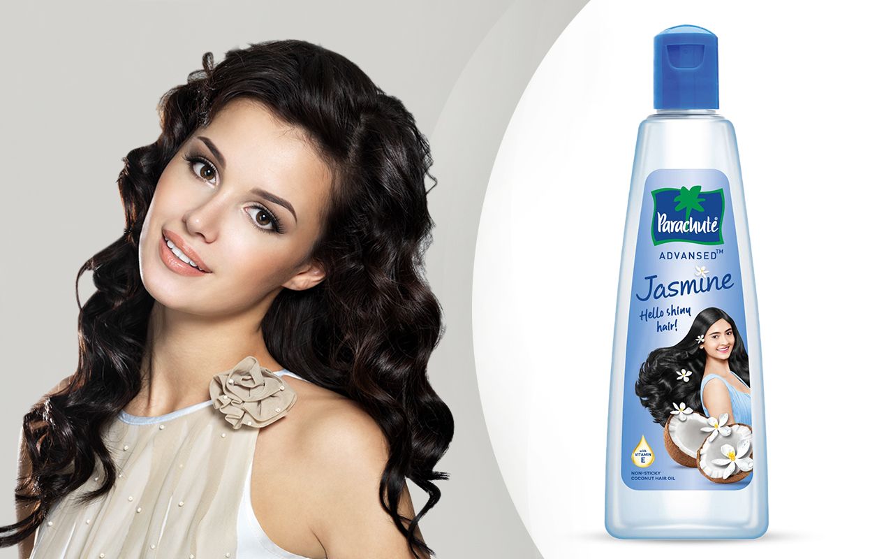 Parachute Advanced Jasmine Hair Oil and a woman with smooth and healthy  hair