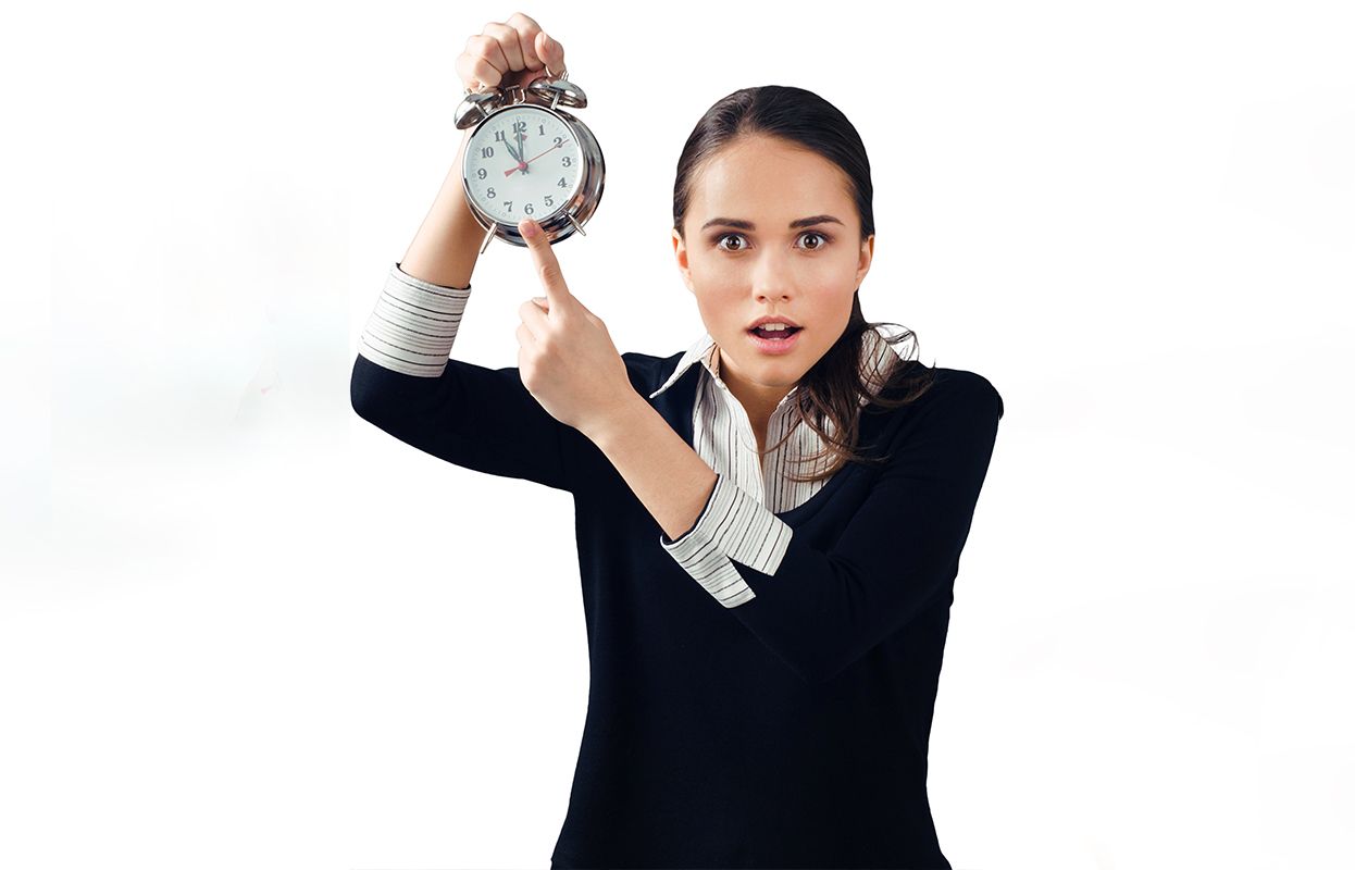 a woman with a clock in hand