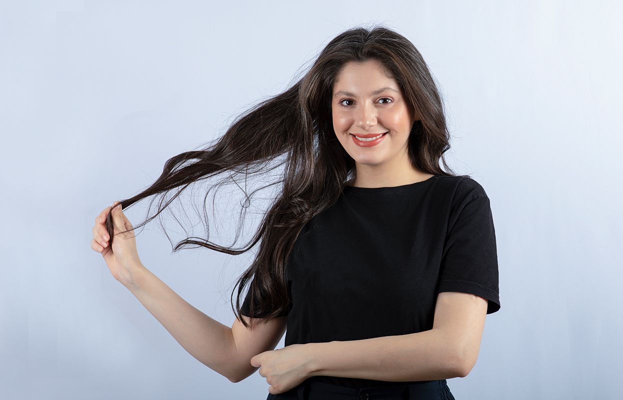 A woman flaunting thick and long hair