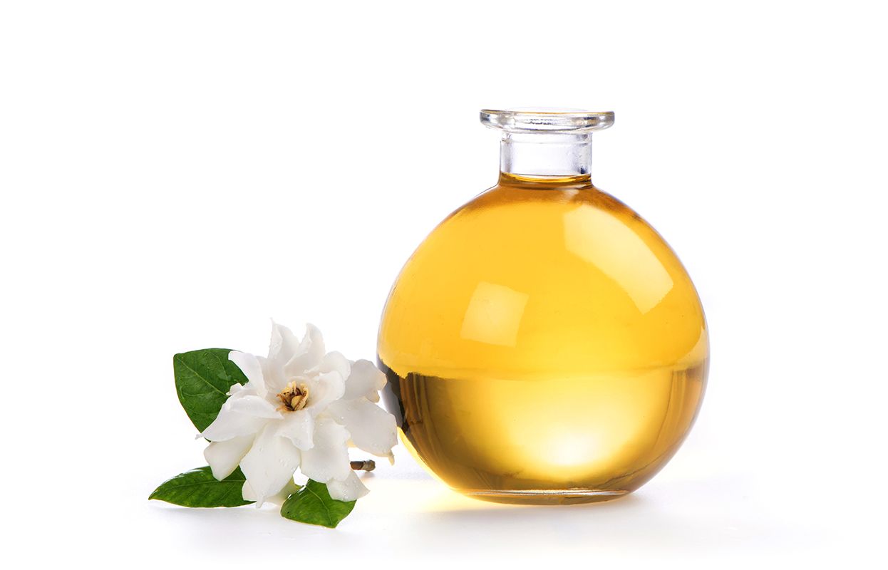 Jasmine flower + a bottle of oil