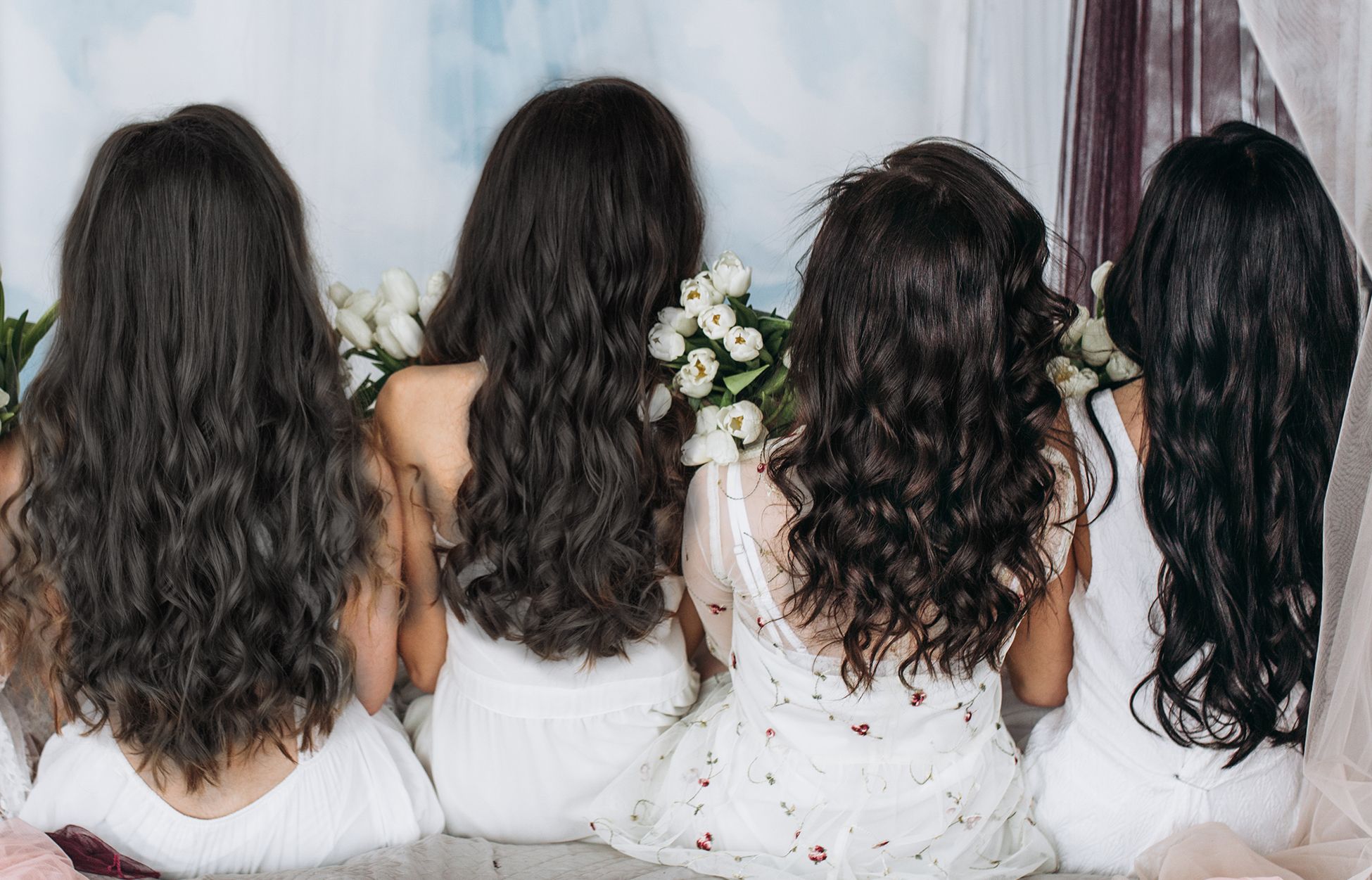  women with long shiny hair, with their backs to the camera