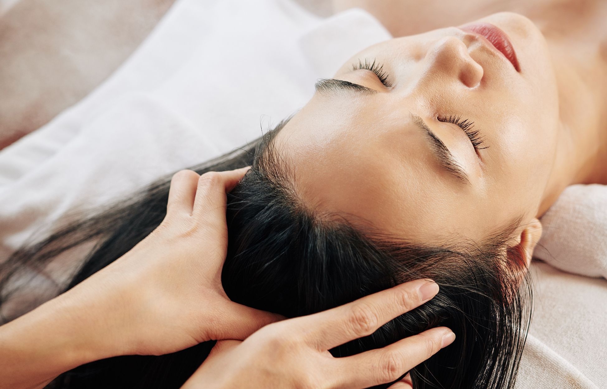 Woman massaging her scalp