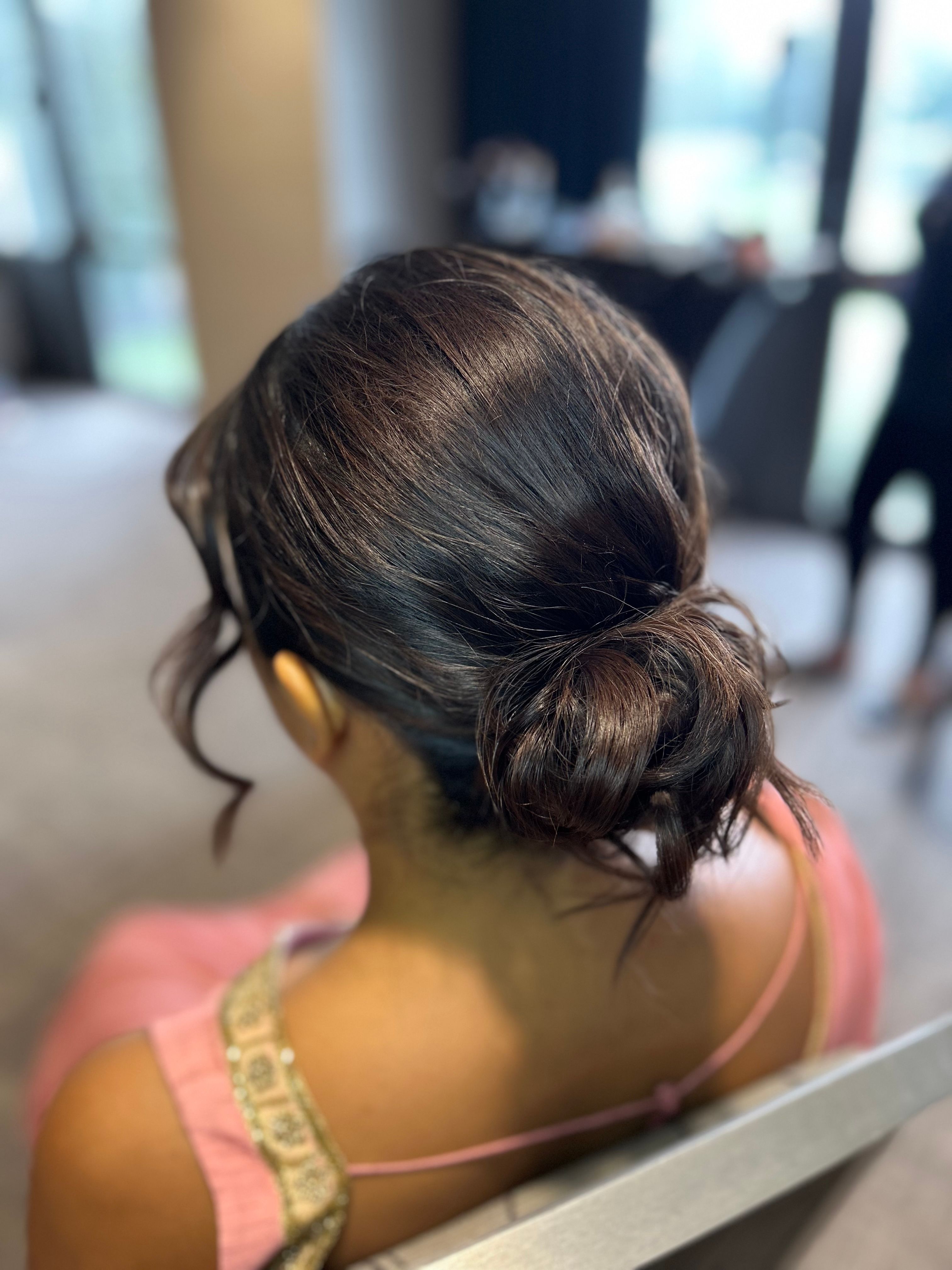 Textured Bun With Face Framing Locks