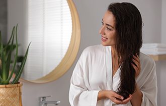 Girl with Nourished Hair Using Non-sticky hair oil