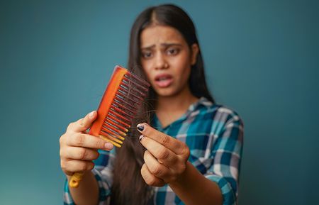 Girl Worried about Hairfall