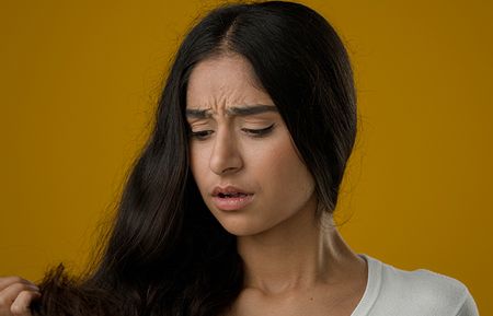 Girl Concerned about her dry hair