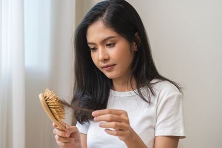  Girl concerned about Hair Fall