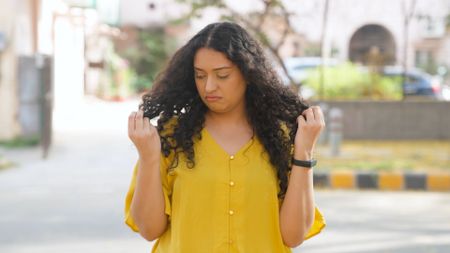Girl concerned about her rough hair