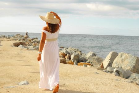 Girl covering her hair with hat