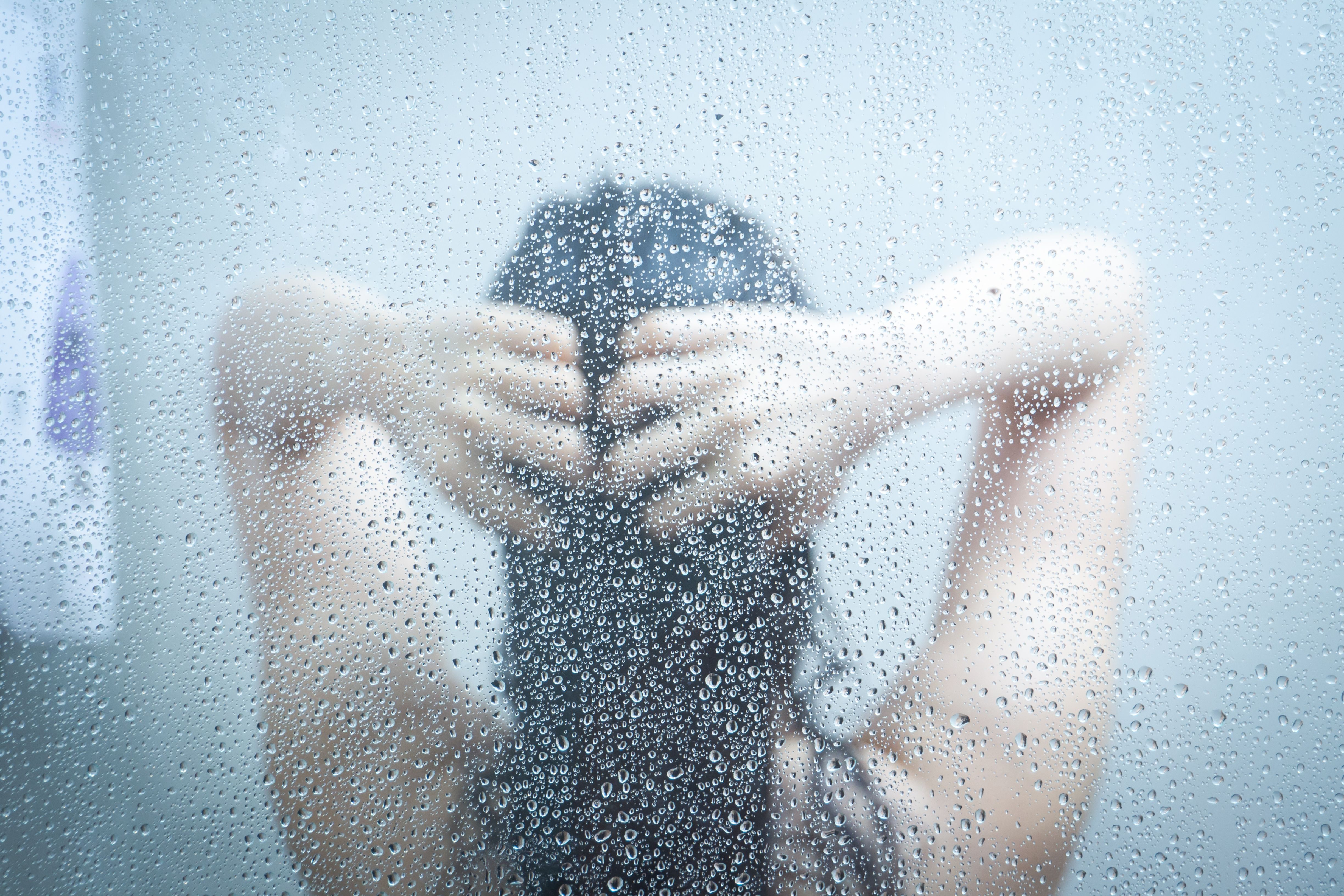 Girl having shower in lukewarm water