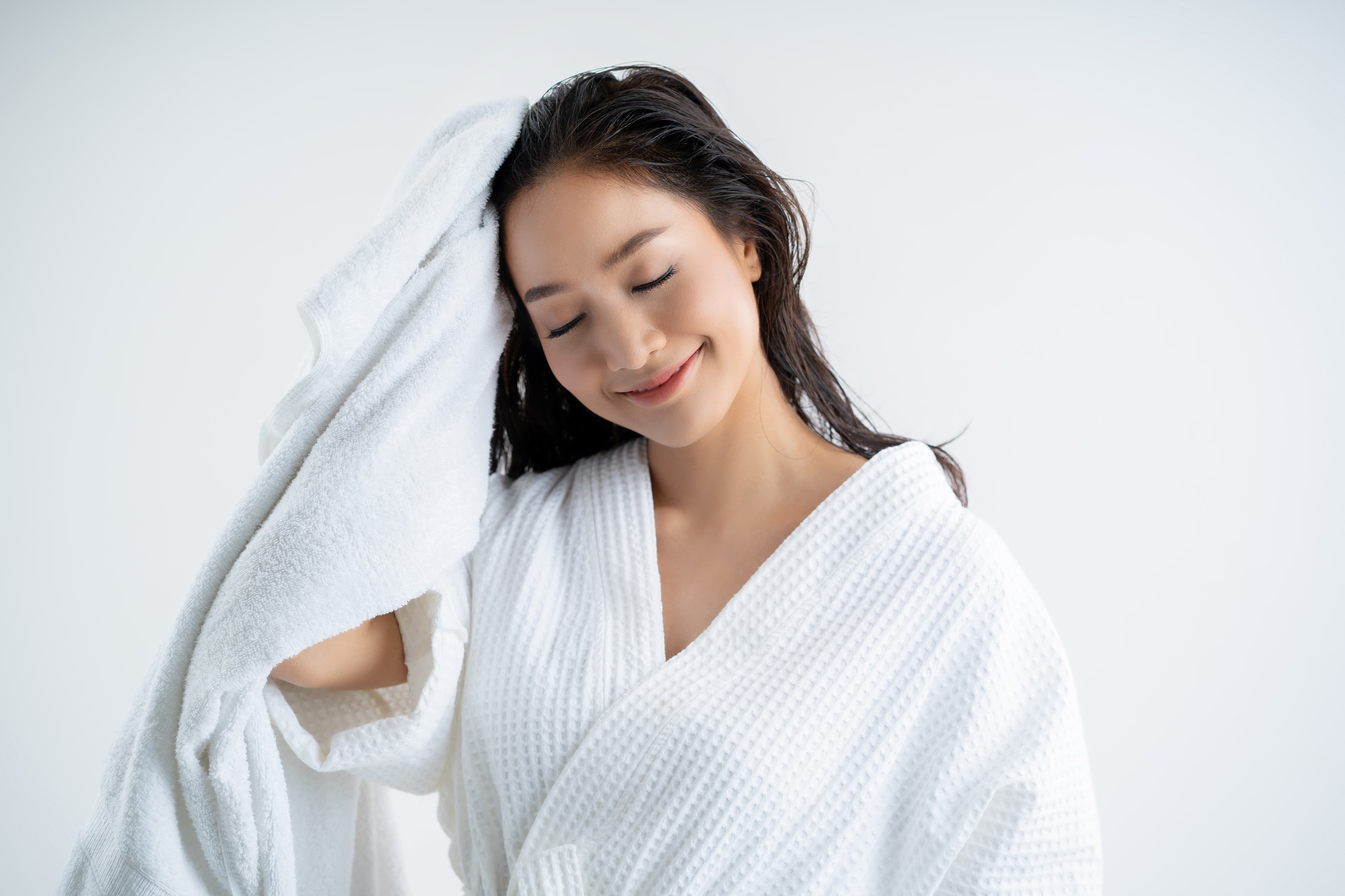 Girl towel drying her hair