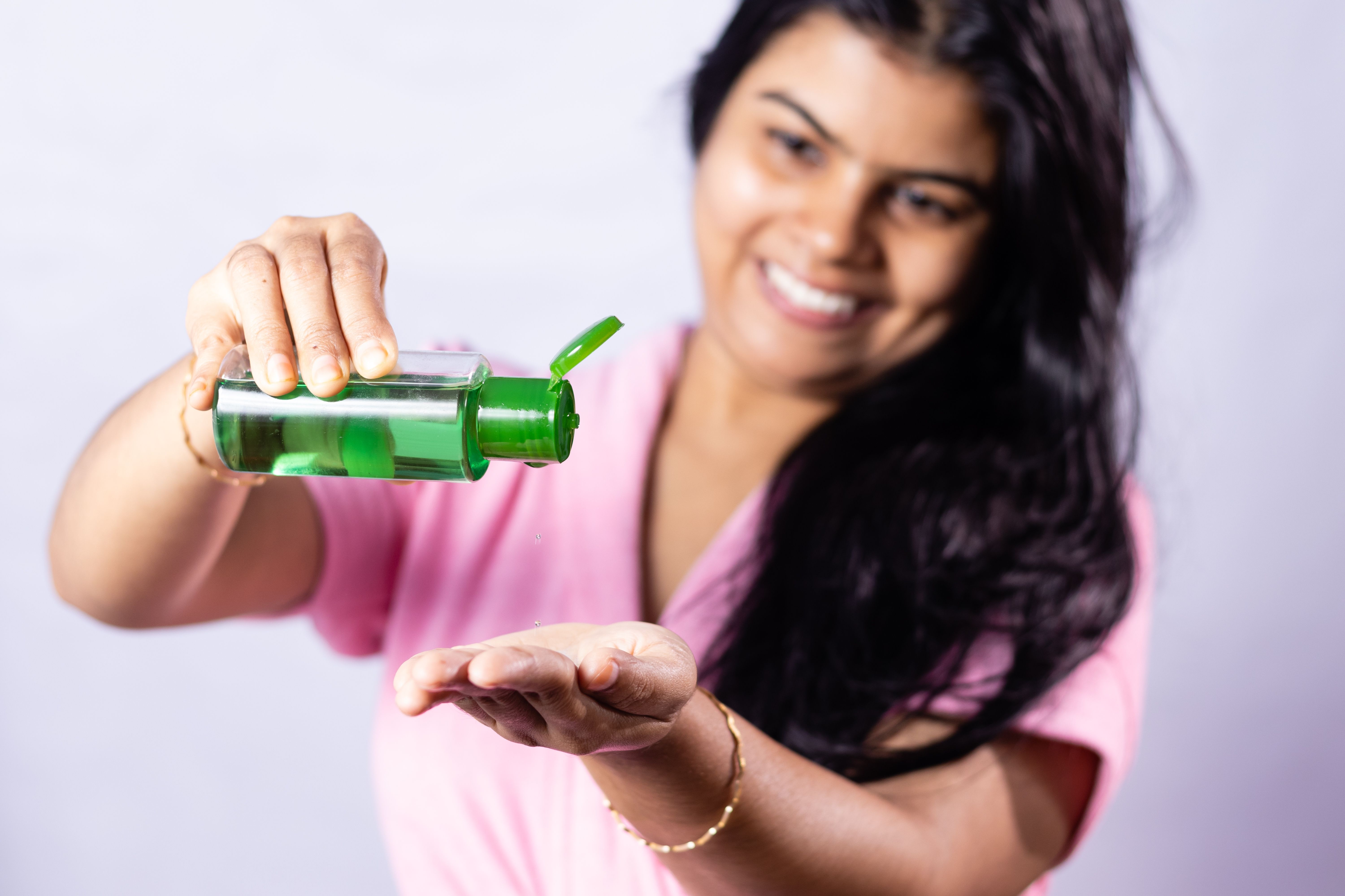  Girl applying hair oil