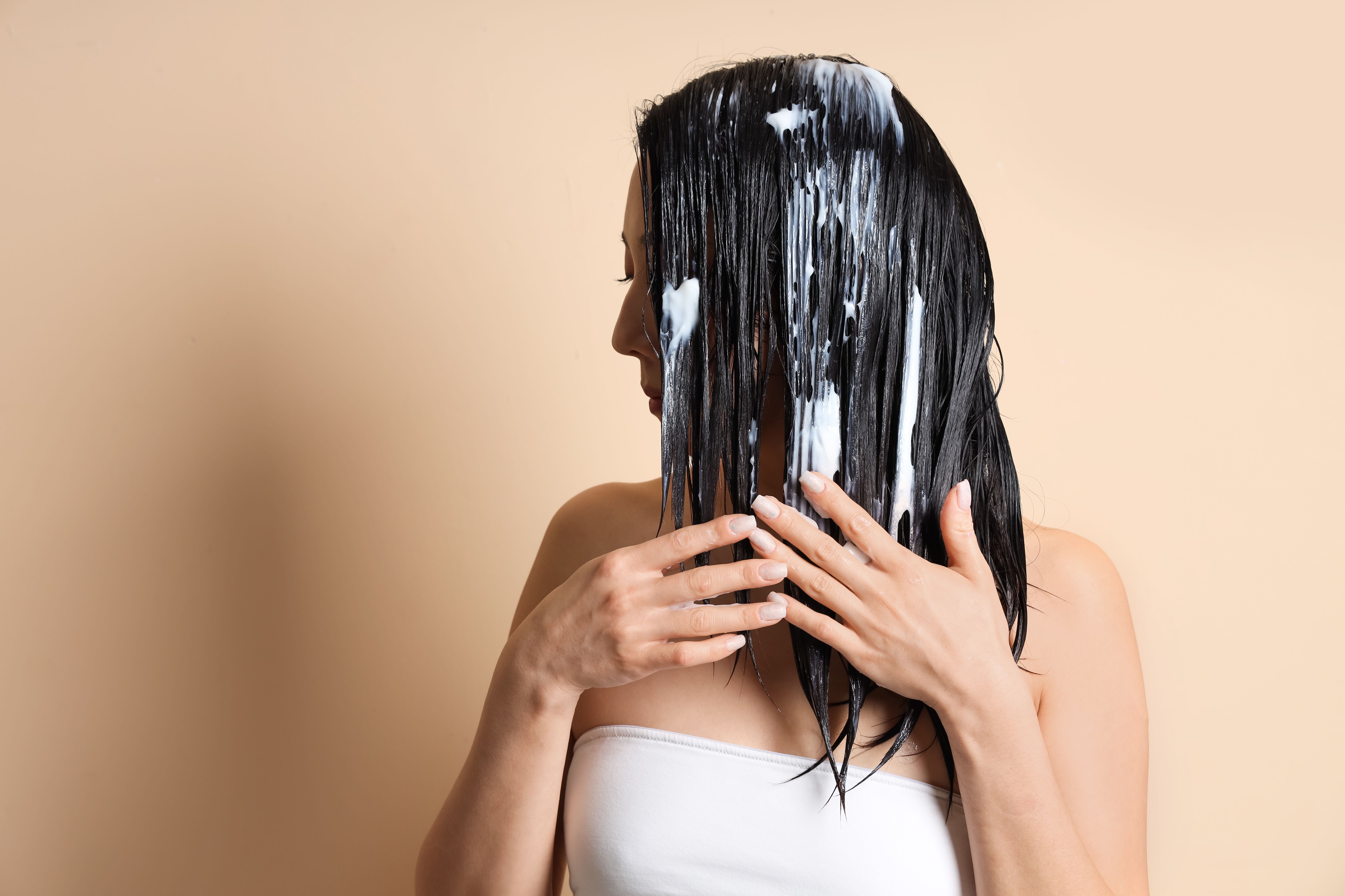 Girl applying hair mask