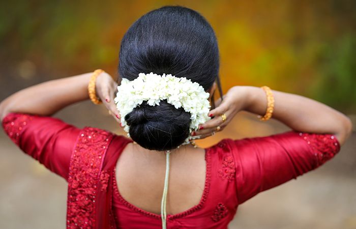 Sleek Bun Covered in Gajra Hairstyle