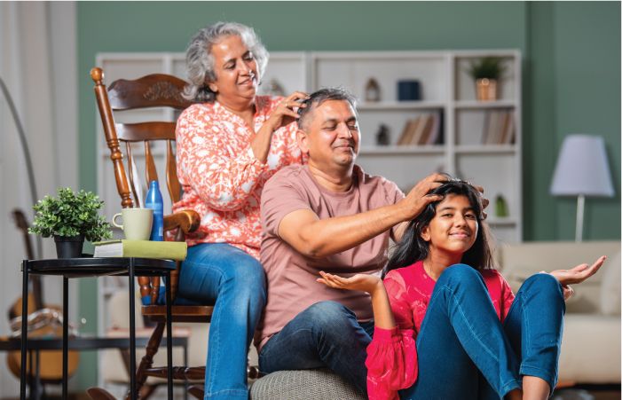 Indian Family Applying Hair Oil