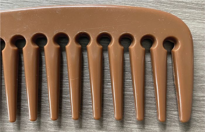 Use a Wide-Toothed Comb to Detangle Hair Gently