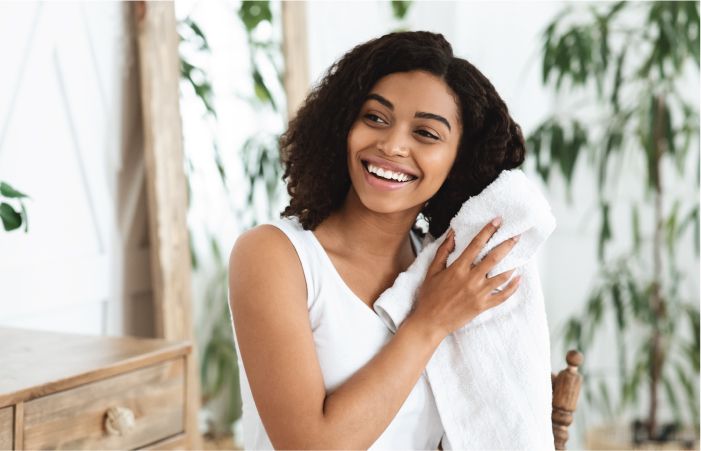 Women Using Towel to Dry Her Hair