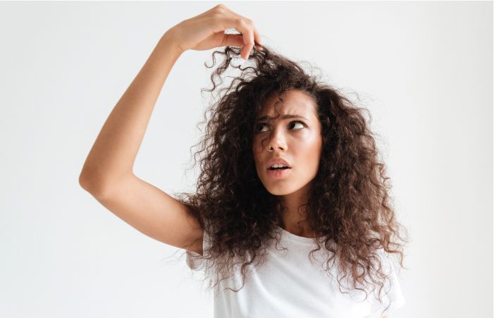 Women Looking at Her Hair